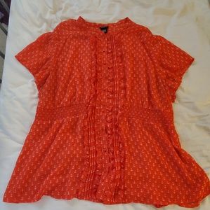 Red button down blouse with white anchor pattern